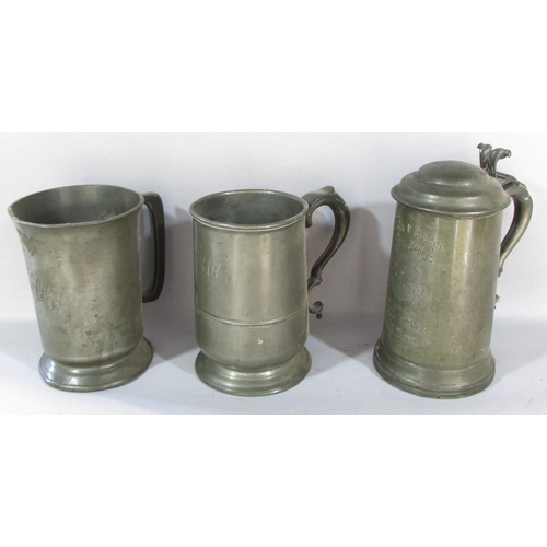 478 - A varied selection of early 19th century pewter table ware, including tankards, jugs, a pair of cand... 