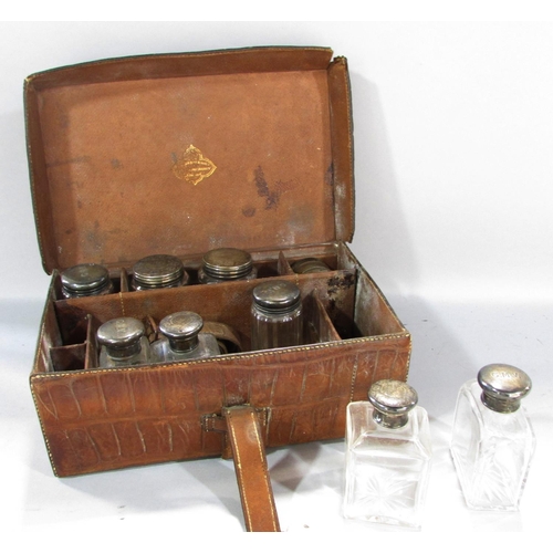 483 - A leather travel box with silver plated jars, Sorrento box, writing slope and Moroccan leather trave... 