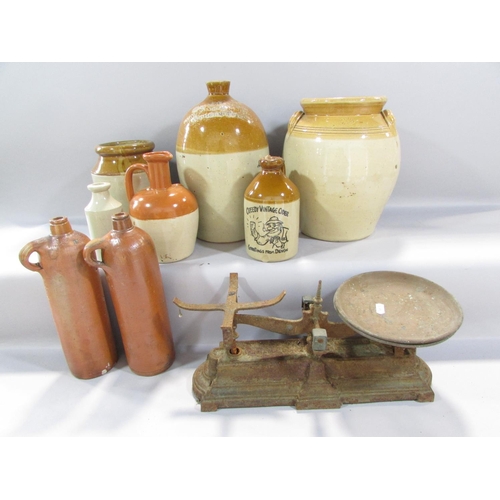 488 - Stoneware flagons and various stoneware storage jars and cast iron scale etc