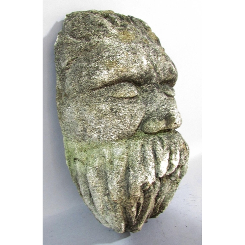 490 - A reconstituted stone cast face of a bearded man, 27cm x 15cm