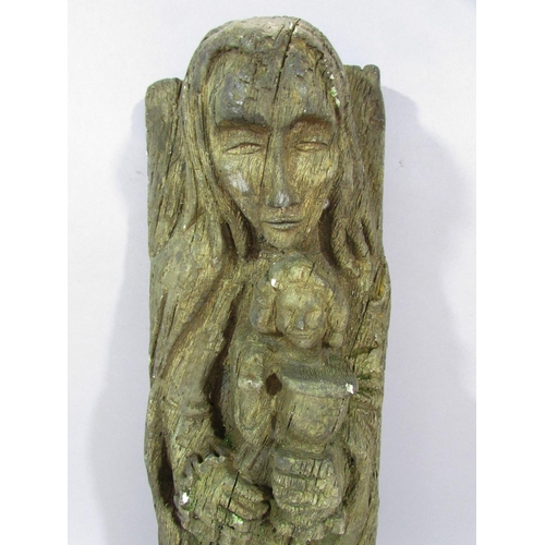 491 - A simulated oak carving, in plaster, a figure of the Virgin Mary holding Baby Jesus, 40cm x 13cm.