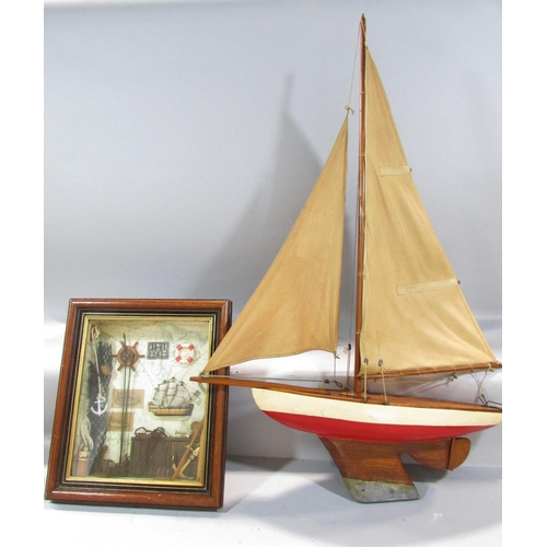 496 - A vintage single mast pond yacht, with a lead re-enforced keel, 60cm long x 85cm high, and a framed ... 