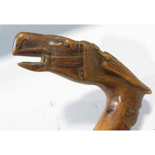 497 - A walking stick with a carved head of a bridled horse handle, with an indistinct stamp, 83cm.