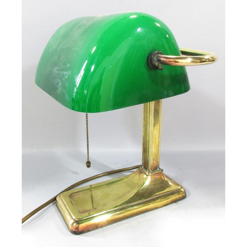 501 - A Brass bankers lamp with a swivel green glass shade. 28cm high.