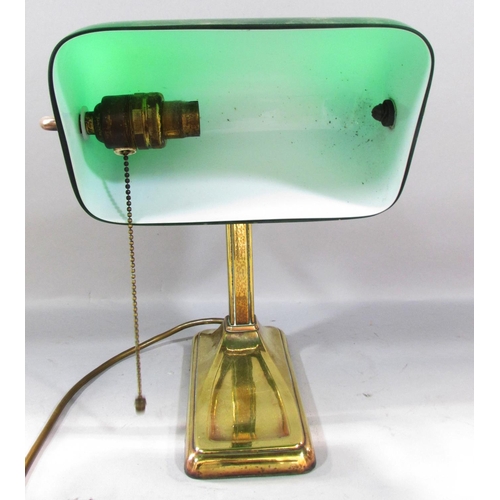 501 - A Brass bankers lamp with a swivel green glass shade. 28cm high.