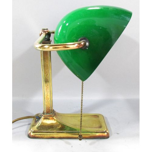 501 - A Brass bankers lamp with a swivel green glass shade. 28cm high.