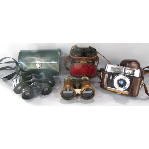 503 - A Voigtlander vintage camera, a pair of military binoculars, a pair of green rubberised water resist... 