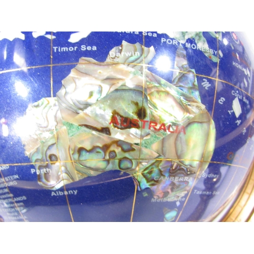 506 - An ICYY Co. Gemstone Globe, with countries picked out in various semi-precious stone, set on a brass... 