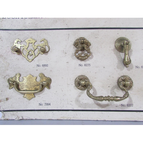 510 - A Lilly Craftsman In Brass samples board of period style brass drawer handles.