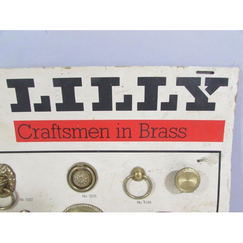 510 - A Lilly Craftsman In Brass samples board of period style brass drawer handles.