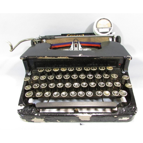 517 - An early 20th century Corona typewriter in its original carry case.