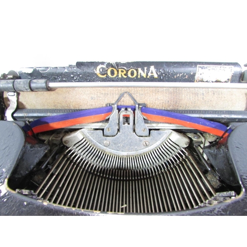 517 - An early 20th century Corona typewriter in its original carry case.