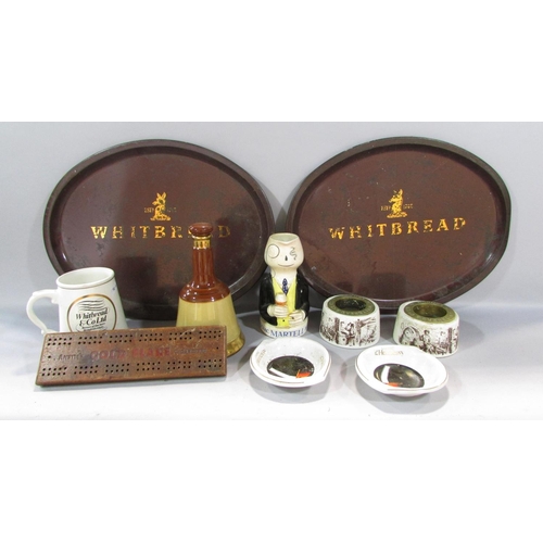 522 - A pair of Whitbread metal trays, a pair Whitbread match strikers, Martel Brandy Mug etc