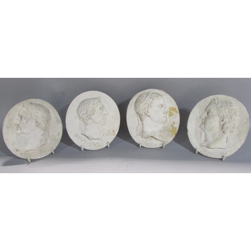 535 - Four grand tour style oval plaster classical profile portraits of Roman dignitaries, after the antiq... 