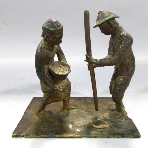 542 - A bronze study of two South East Asian Farmers toiling. 12cm high x 12cm.