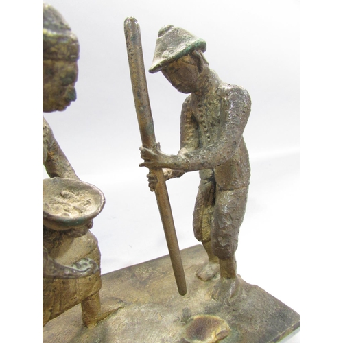 542 - A bronze study of two South East Asian Farmers toiling. 12cm high x 12cm.