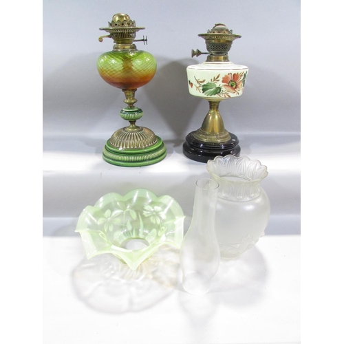 547 - Two 19th century oil lamp bases, a pressed glass shade, a chimney and a Vaseline glass floral decora... 