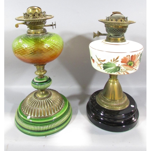 547 - Two 19th century oil lamp bases, a pressed glass shade, a chimney and a Vaseline glass floral decora... 