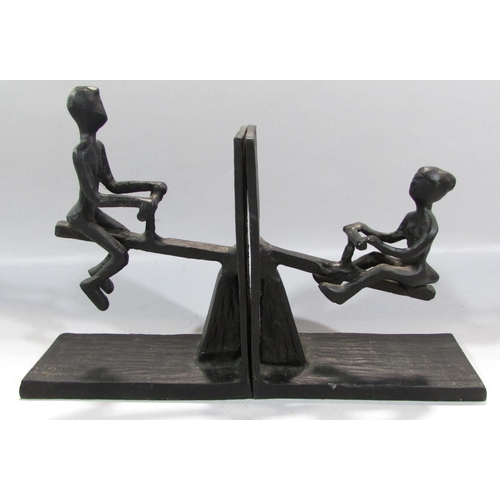 548 - A pair of novelty wrought iron see-saw book ends.