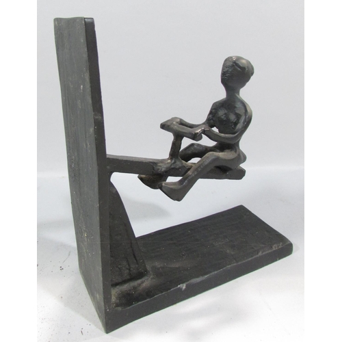 548 - A pair of novelty wrought iron see-saw book ends.