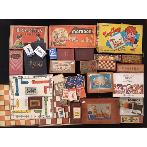 1726 - A large collection of vintage toy games and toys including Chess, Dominos, various card games, Monop... 