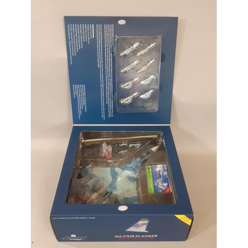 1748 - 4 boxed models  of aircraft and a jet car comprising 1:72 scale SU-27UB Flanker Russia Airforce 58, ... 