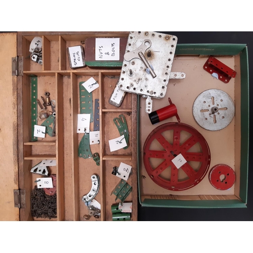 1757 - A collection of 1940s - 50s Meccano, sorted and labelled including a clockwork motor, hub disks, gir... 