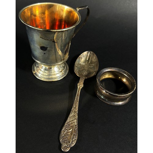 180A - A silver Christening cup, a presentation spoon and a napkin ring, 3.7 oz (3)