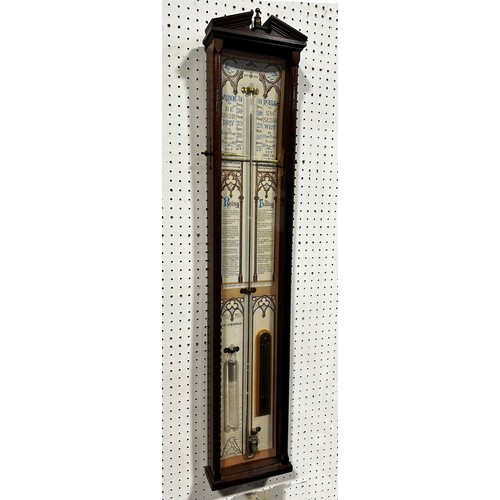 459 - An Admiral Fitzroy barometer, the printed back with Gothic tracery outline, set within a mahogany ca... 