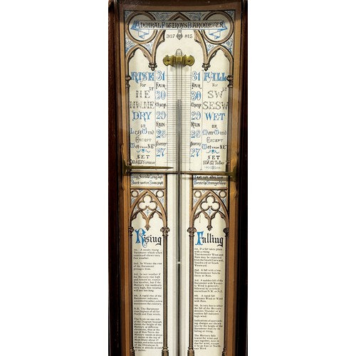 459 - An Admiral Fitzroy barometer, the printed back with Gothic tracery outline, set within a mahogany ca... 