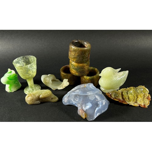 216 - An interesting collection of Chinese carved jade, bowenite jade and hard stone objects to include a ... 