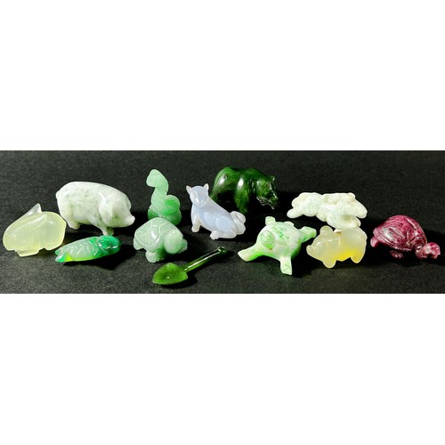 217 - A small collection of Chinese carved hardstone, jadeite and quartz figures to include a cat eating a... 