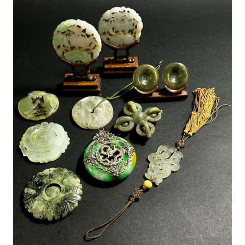 218 - A group of nine Chinese carved jadeite / bowenite jade / hardstone Bi discs and pendants to include ... 