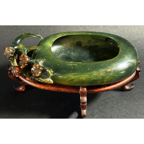 225 - A Chinese translucent spinach green bowenite jade brush washer, of peddle form carved with flowering... 