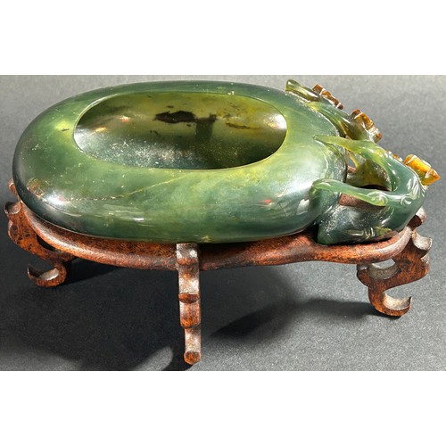 225 - A Chinese translucent spinach green bowenite jade brush washer, of peddle form carved with flowering... 