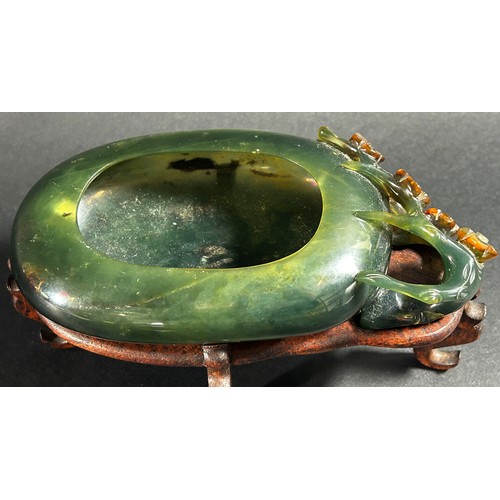 225 - A Chinese translucent spinach green bowenite jade brush washer, of peddle form carved with flowering... 