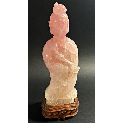 228 - A large Chinese carved green jadeite figure of Guanyin, raised on fixed hardwood stand, 41cm high, t... 