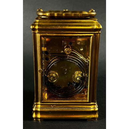 448 - A 19th century brass carriage clock with enamelled dial, with eight day striking movement, currently... 