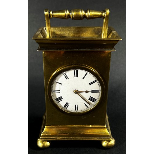 449 - A small 19th century brass mantle clock, the circular enamel dial with a small fusee movement and de... 