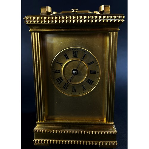 450 - A 19th century brass French carriage clock, the case with reeded and decorative borders, with eight ... 