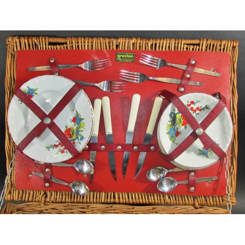 151 - A Collection of mixed silver plate cutlery in a leather valise together with a vintage picnic basket... 