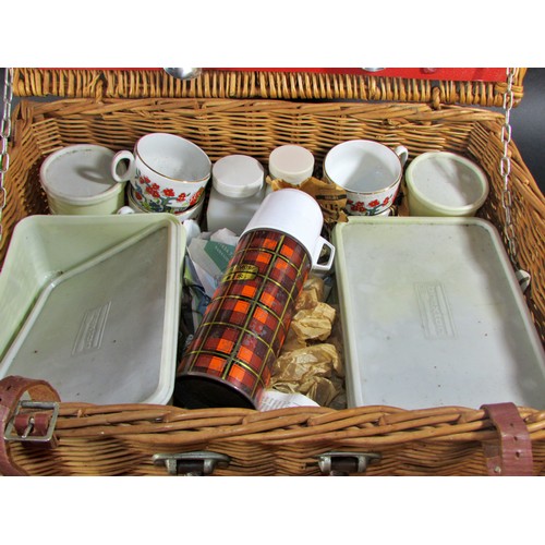 151 - A Collection of mixed silver plate cutlery in a leather valise together with a vintage picnic basket... 