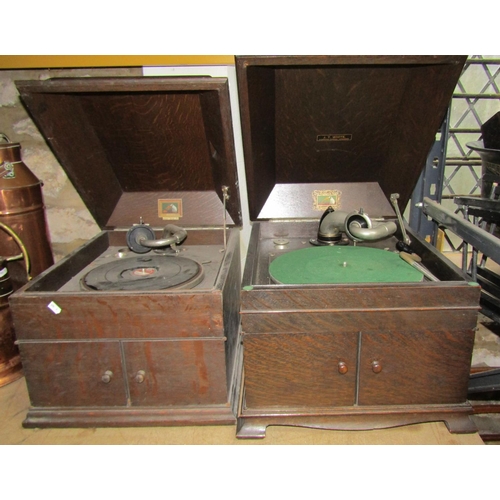 1110 - Two vintage table top  HMV windup gramophones in oak cabinets together with one other (3)