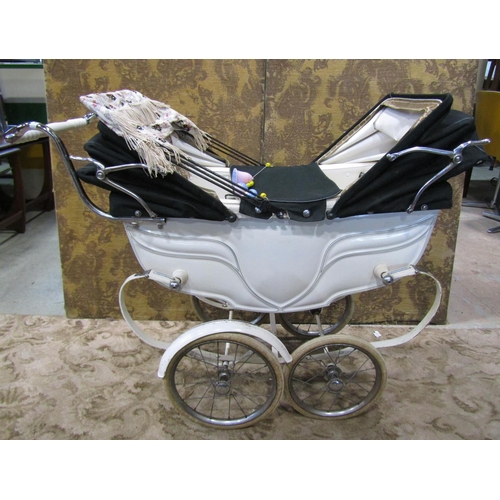 1121 - A 1930s Silver Cross child's pram with original white painted and string lined coachwork, unusual tw... 