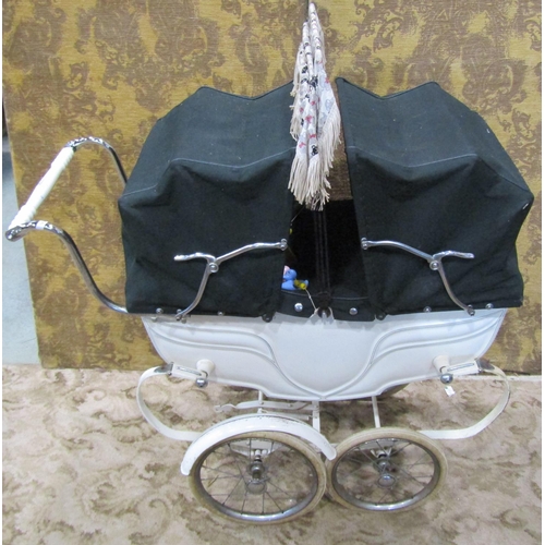 1121 - A 1930s Silver Cross child's pram with original white painted and string lined coachwork, unusual tw... 