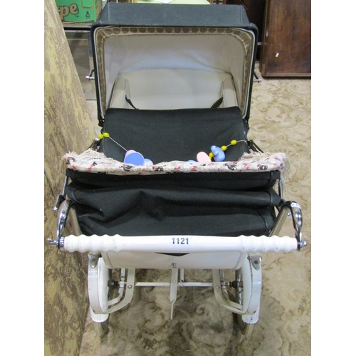 1121 - A 1930s Silver Cross child's pram with original white painted and string lined coachwork, unusual tw... 