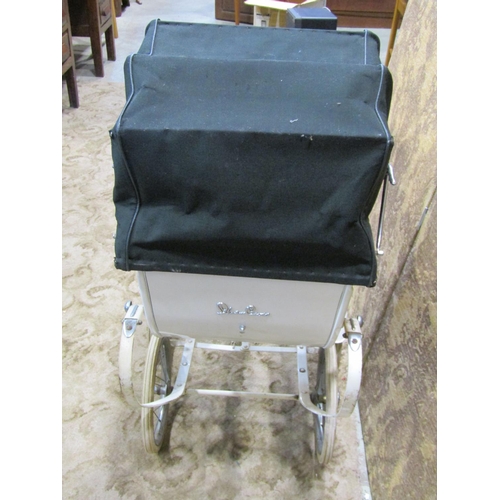 1121 - A 1930s Silver Cross child's pram with original white painted and string lined coachwork, unusual tw... 