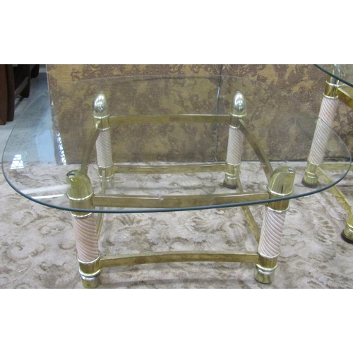 1124 - A set of three contemporary brass and timber occasional tables (a pair and one larger) all with oval... 