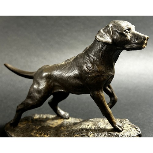 541 - A small bronze recumbent whippet, 21cm from nose to tail (base length) together  with a bronzed resi... 