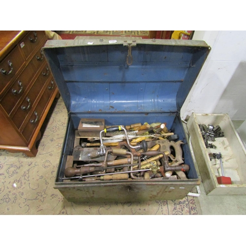 1083 - A steel trunk containing a good miscellaneous selection of hand tools, braces, bits, handsaws, chise... 